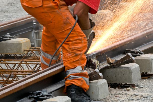 Person works on railway tracks